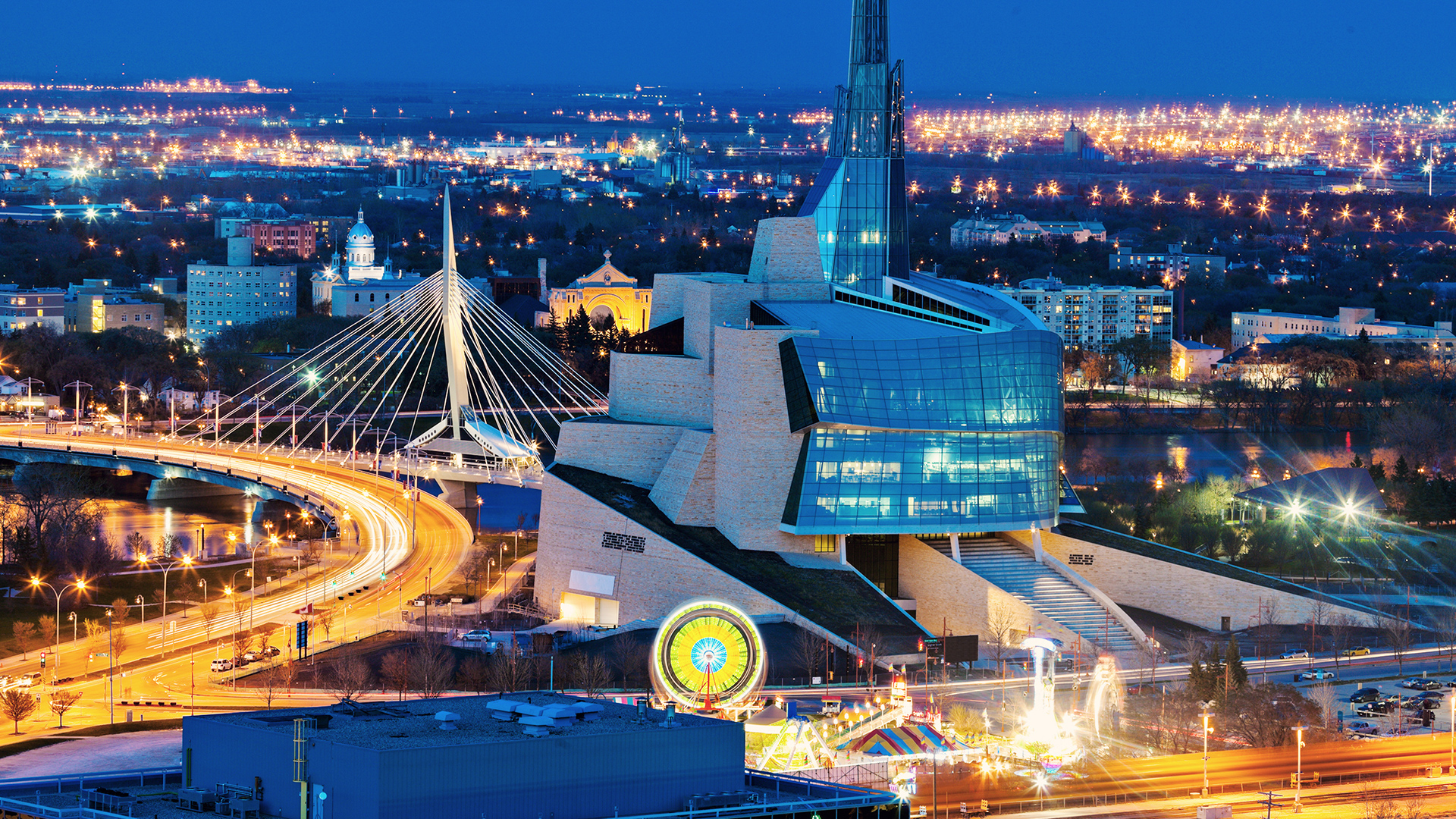 Winnipeg at night with the Canadian Museum for Human Rights in the foreground